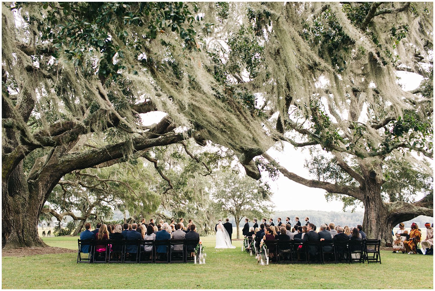 romantic wedding ceremony under oaks