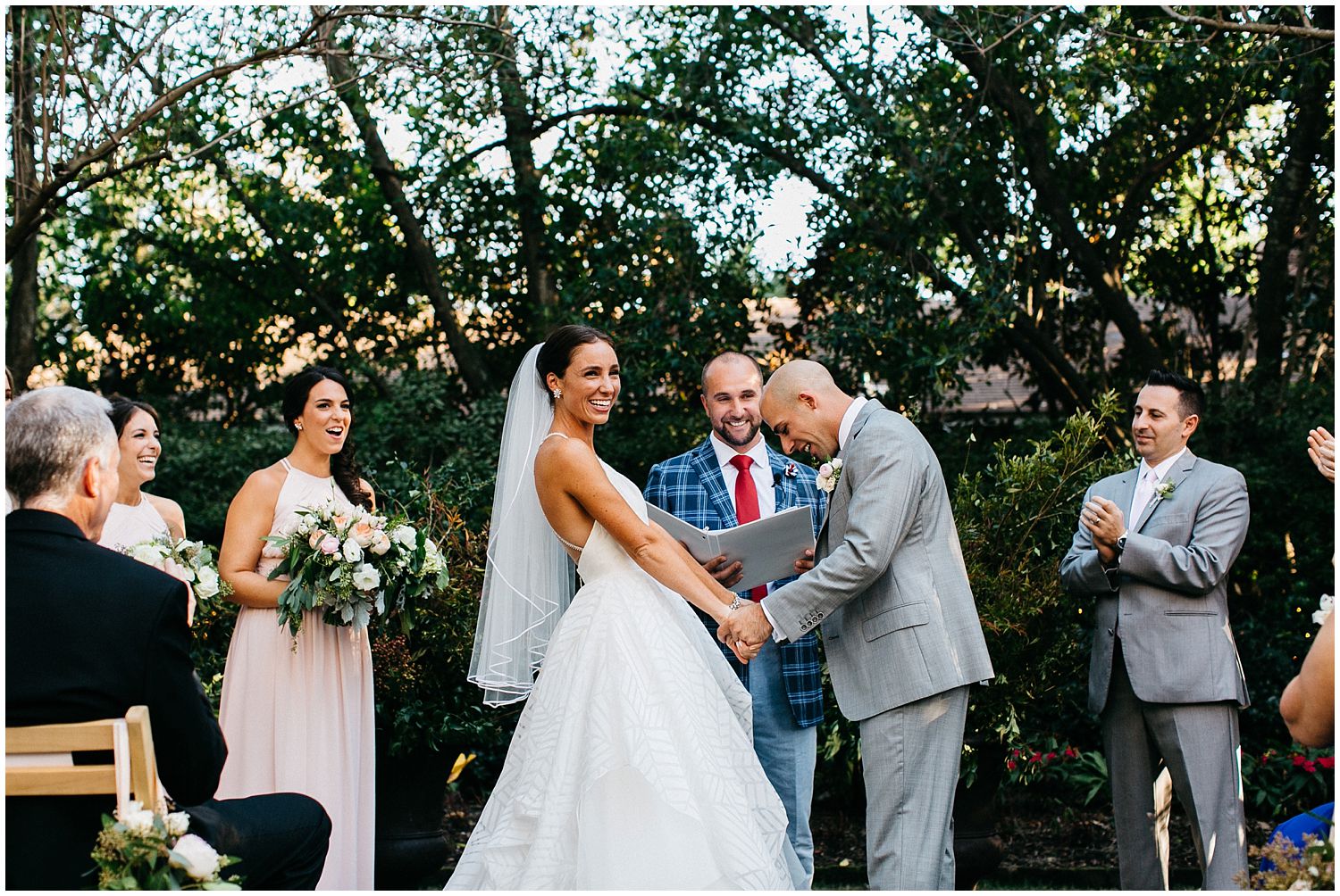 bride and groom laughing during wedding ceremony