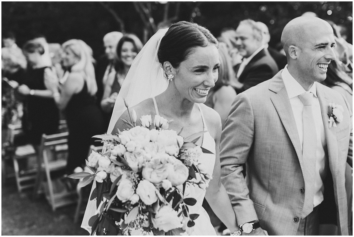 bride and groom recessing down aisle