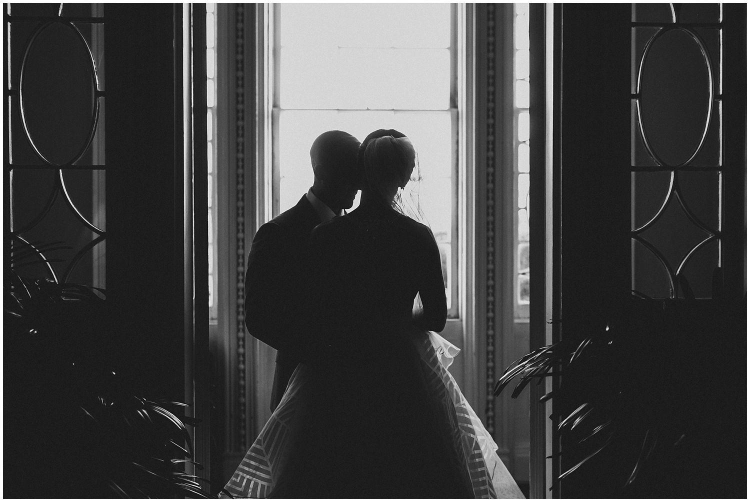 silhouette of bride and groom indoors