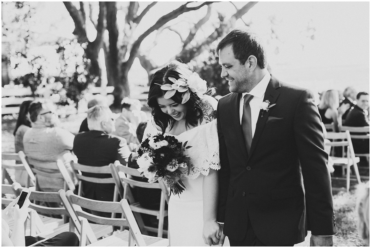 black and white couple recessing down aisle