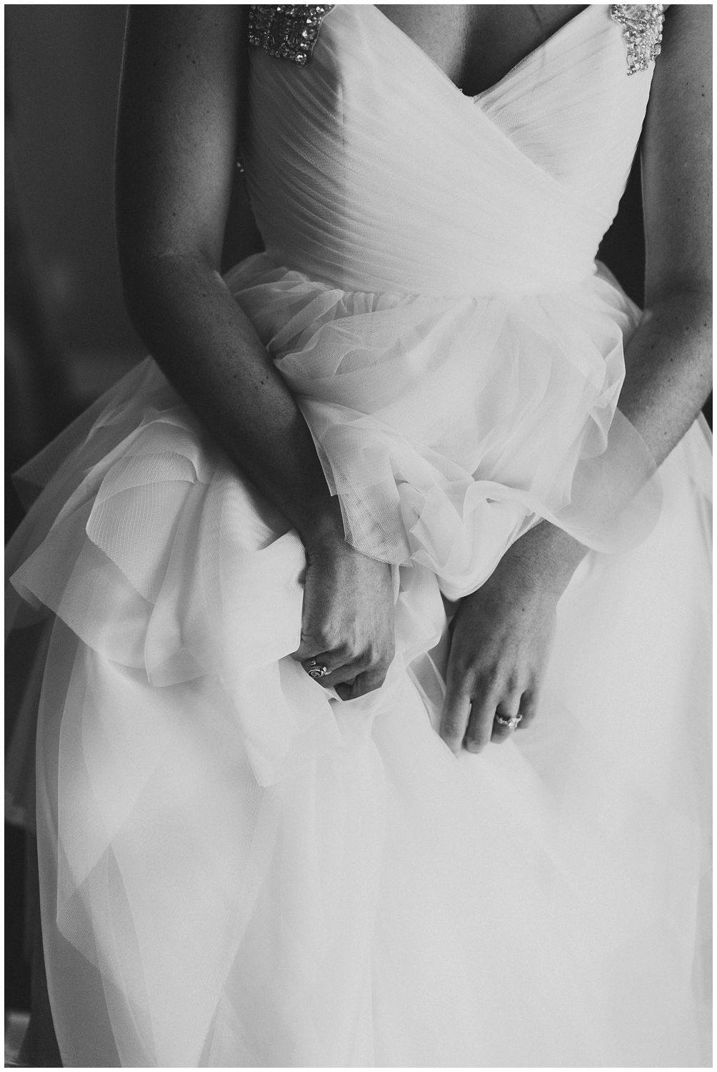 detail of bride getting dressed