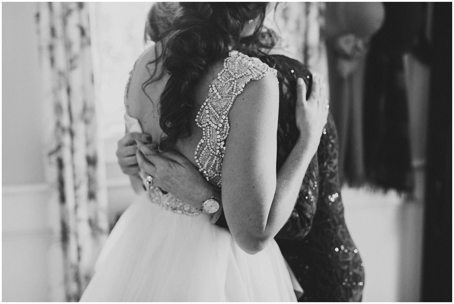 bride hugging mom on wedding day