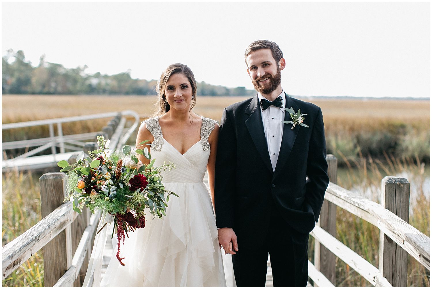 bride and groom on dock