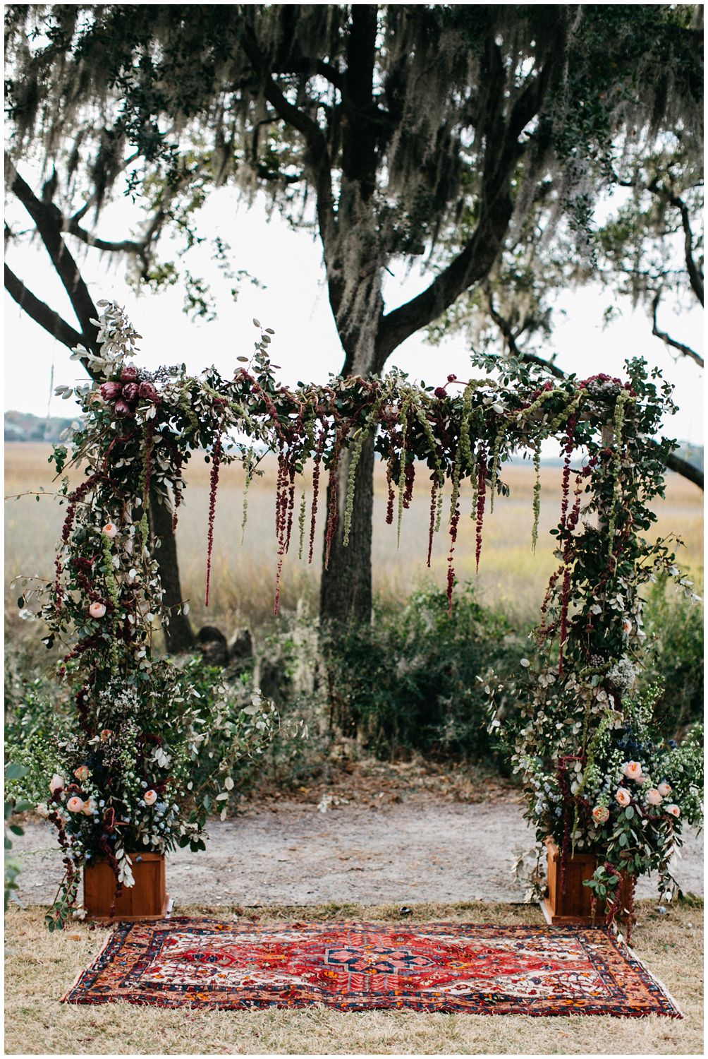 floral arbor and rug for ceremony