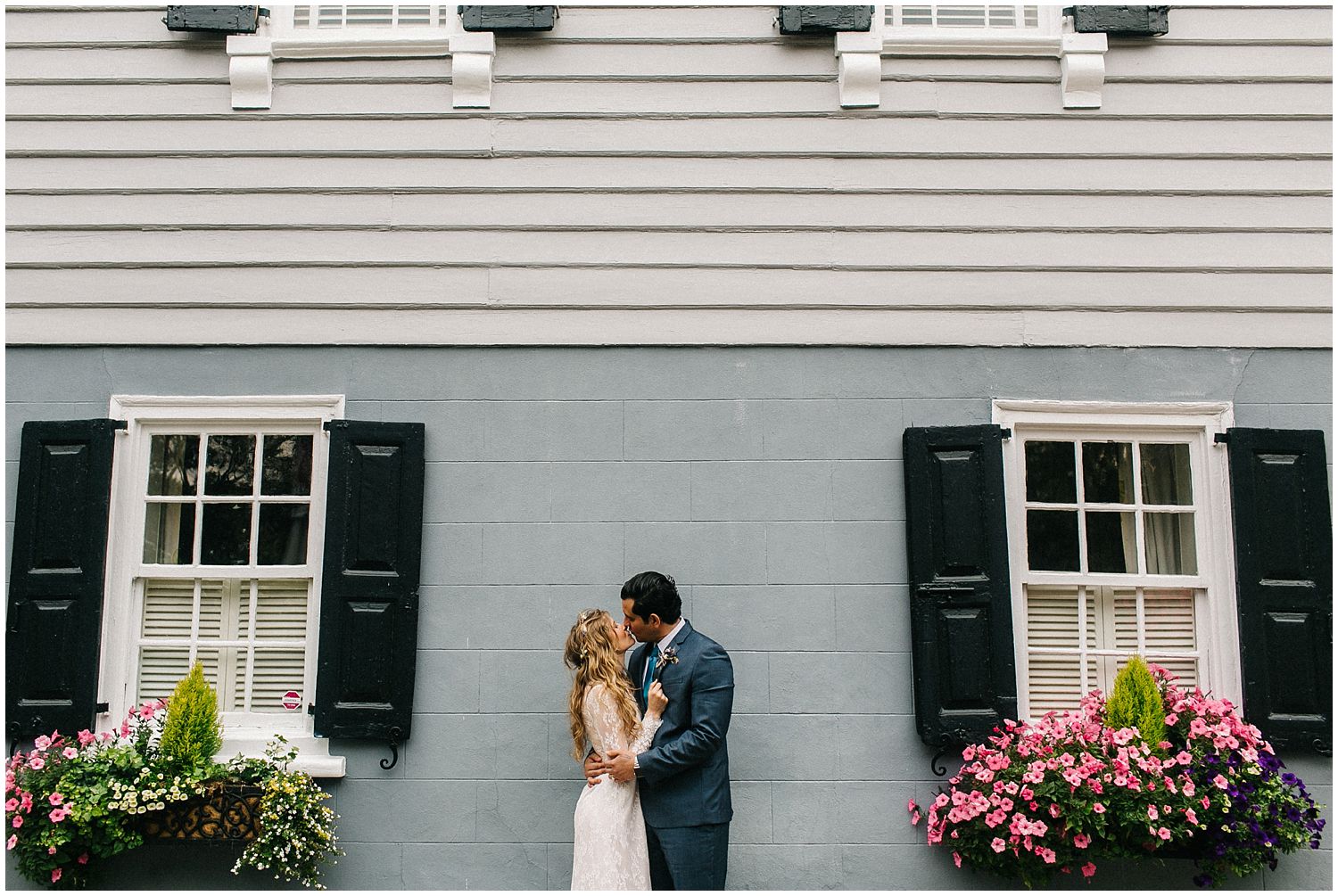 Bride and groom and downtown charleston home