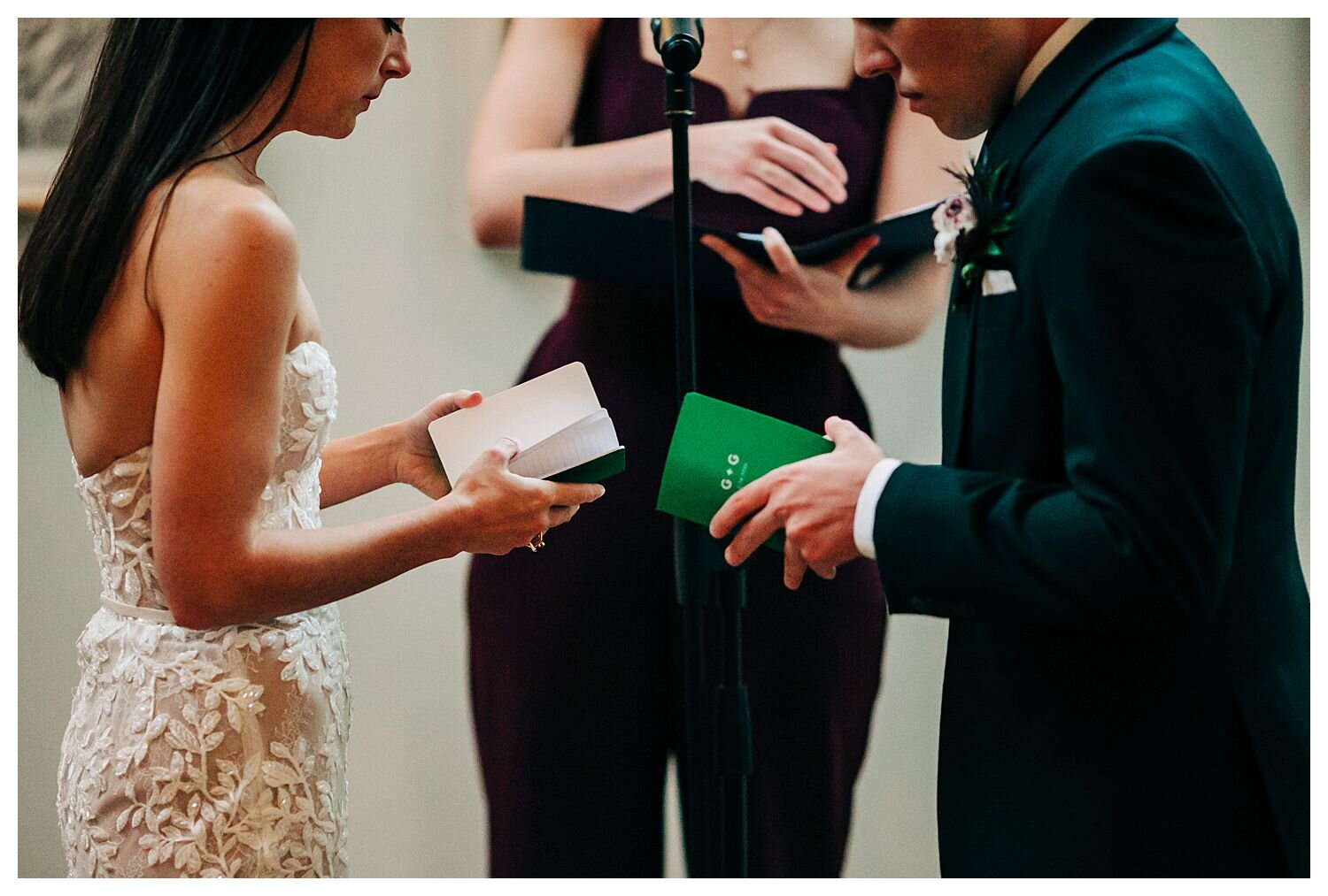 Exchanging handwritten vows during wedding ceremony