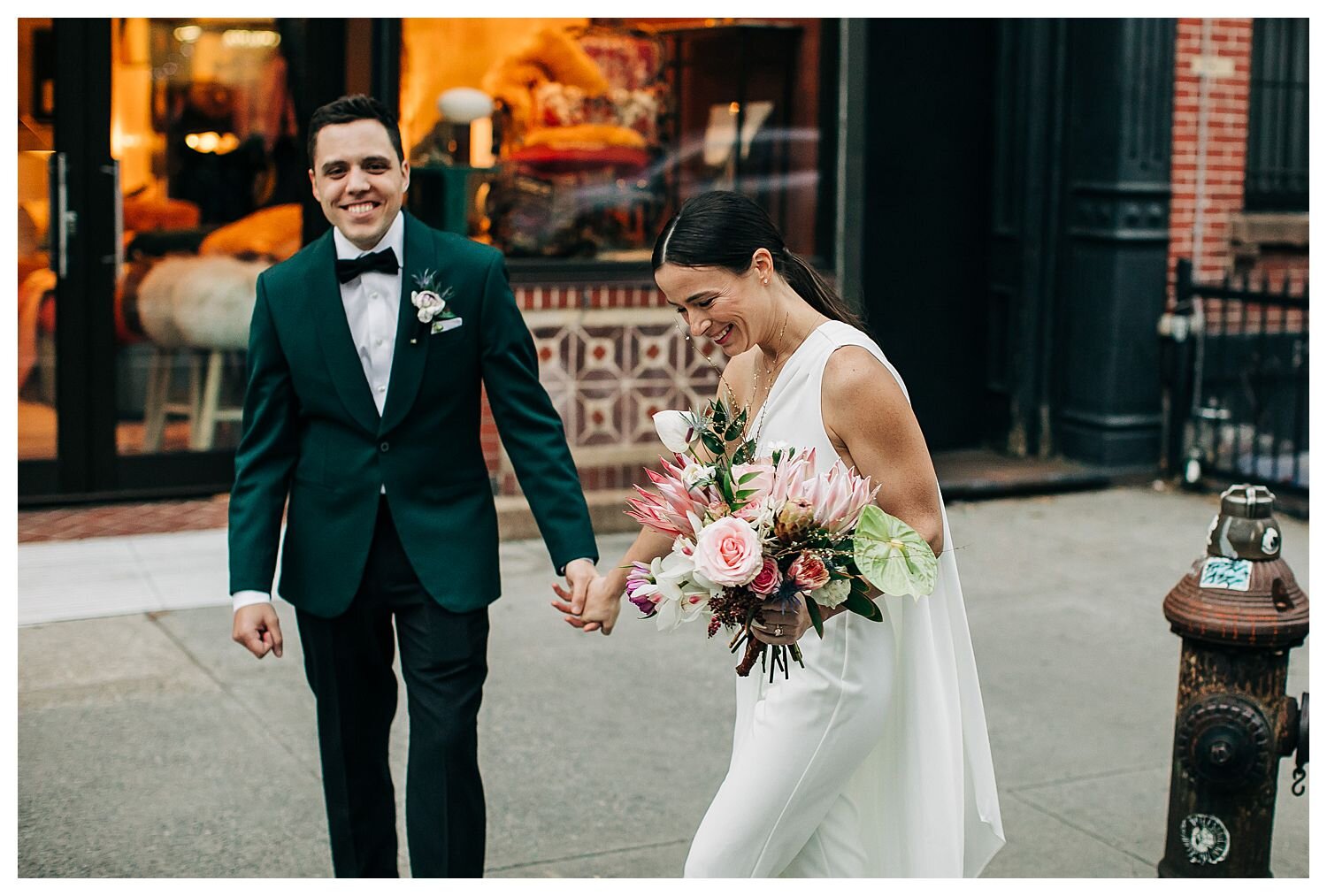 Bride and groom walking streets of Brooklyn