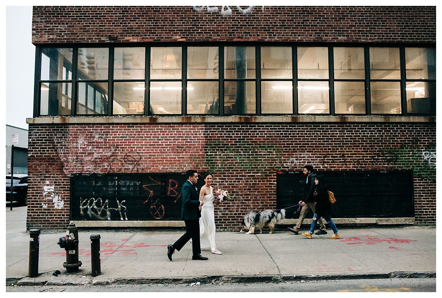 Bride and groom walking streets of Brooklyn