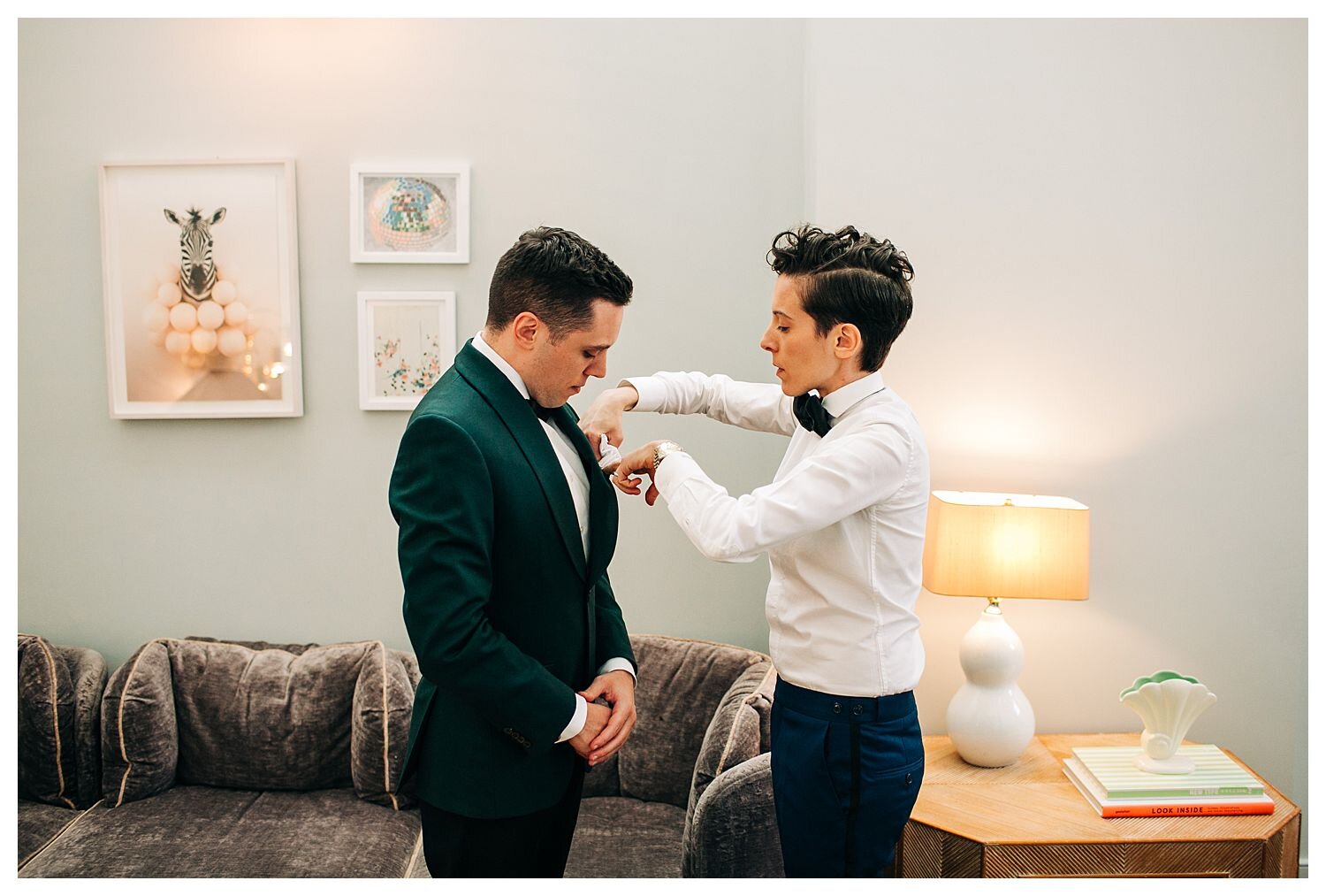 groom getting dressed before wedding