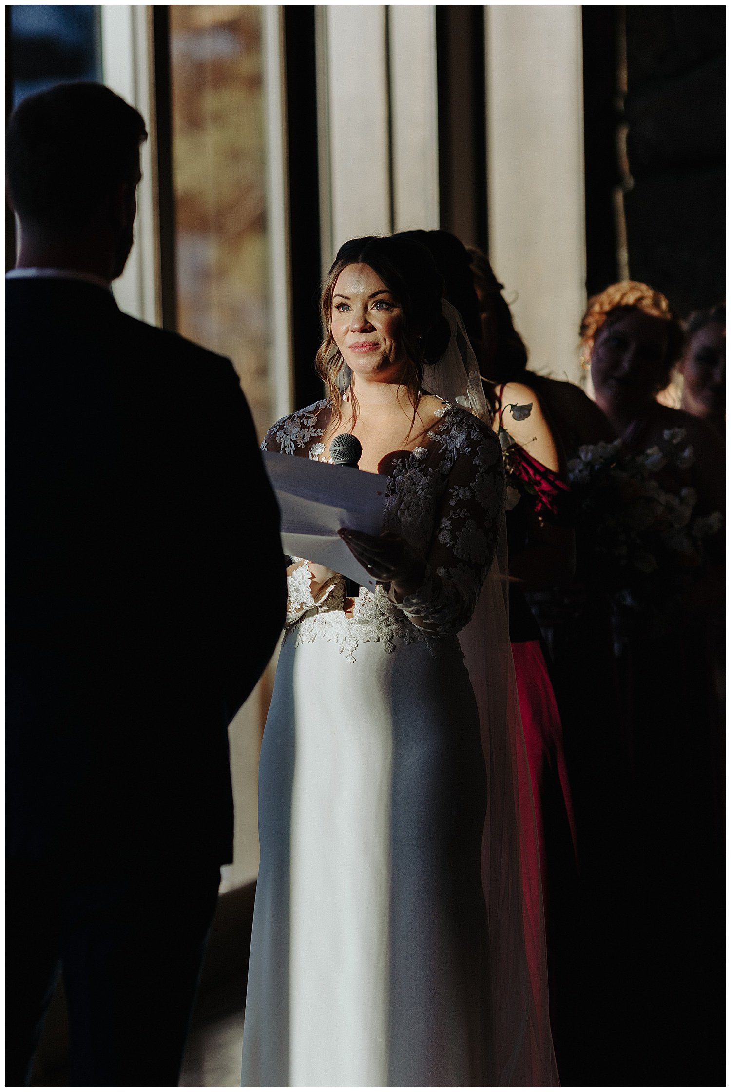 bride reading vows during wedding ceremony