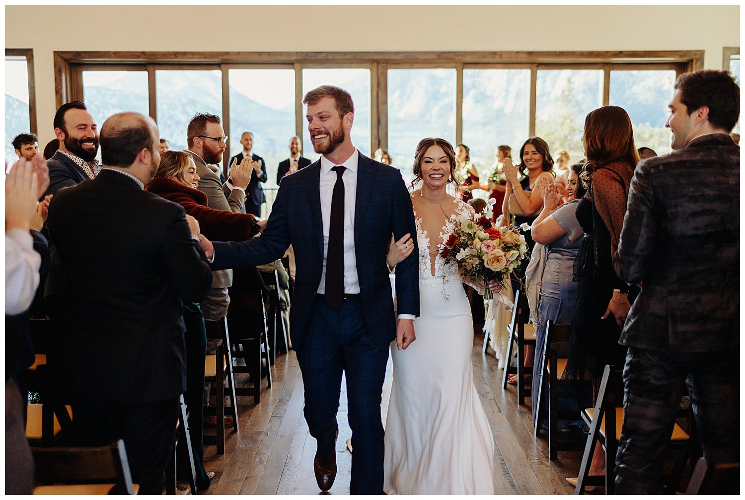 joyful bride and groom walking down aisle