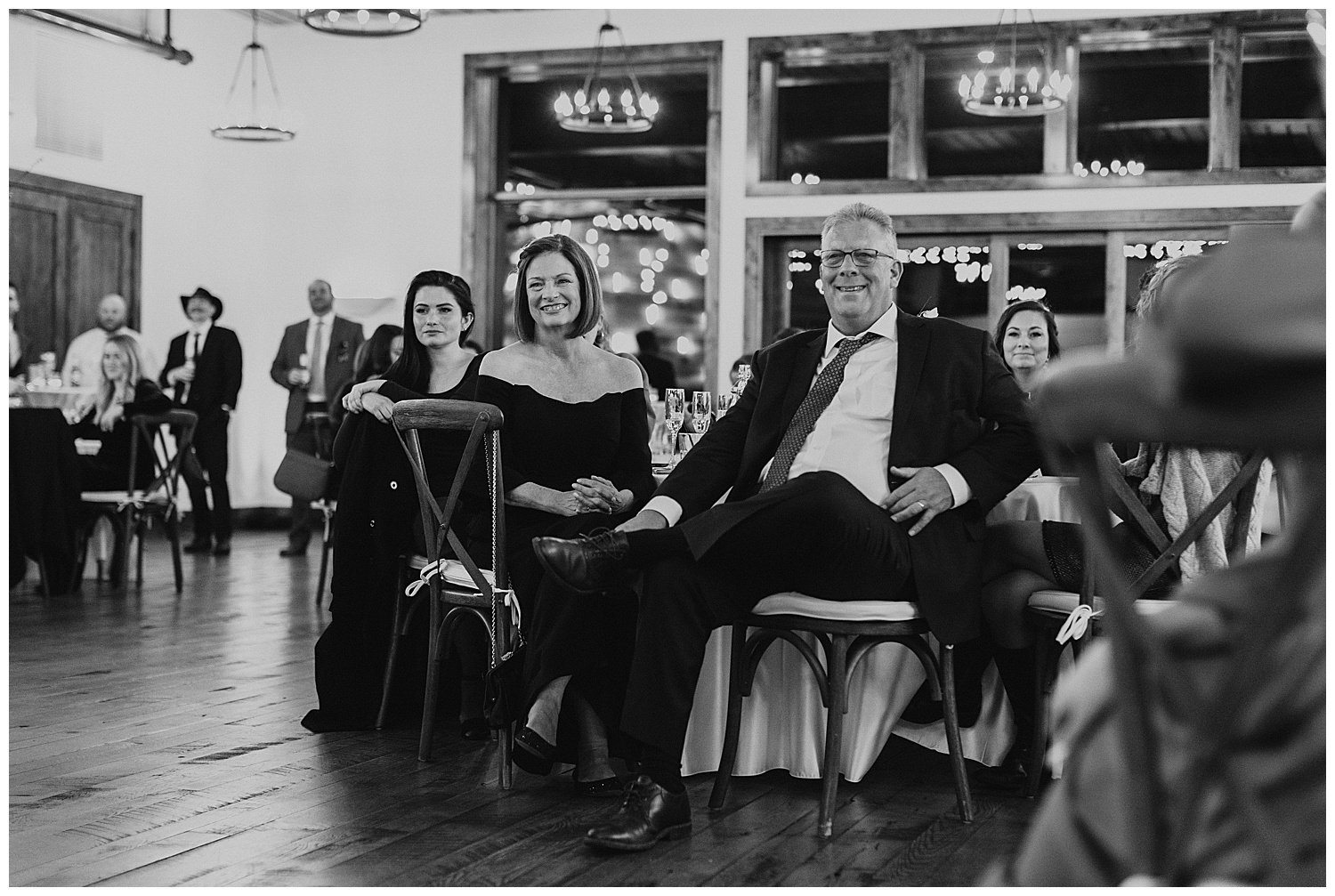 parents listening during wedding toasts