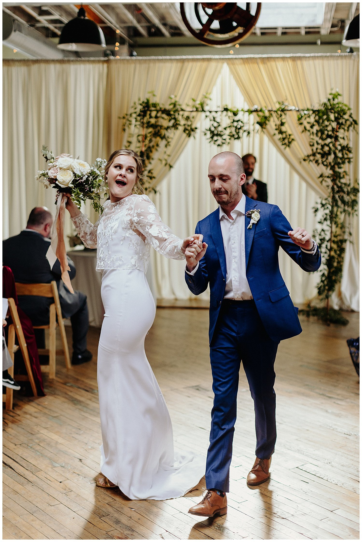 couple dancing while recessing down aisle