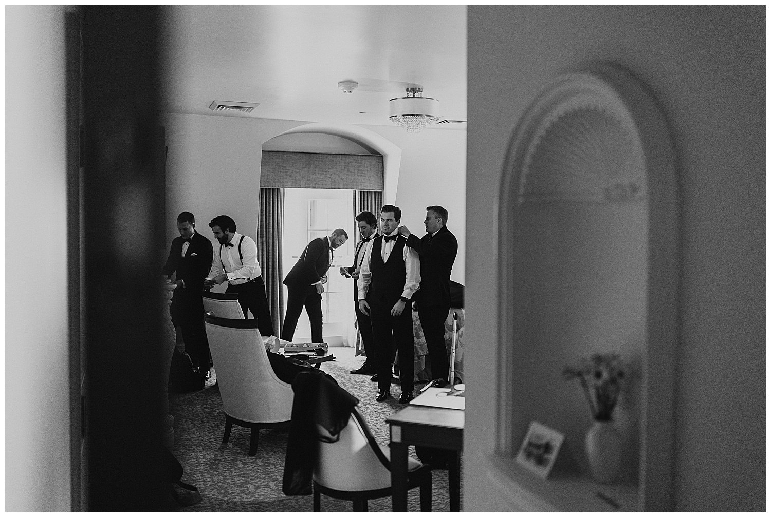 groom and groomsmen getting ready on wedding day