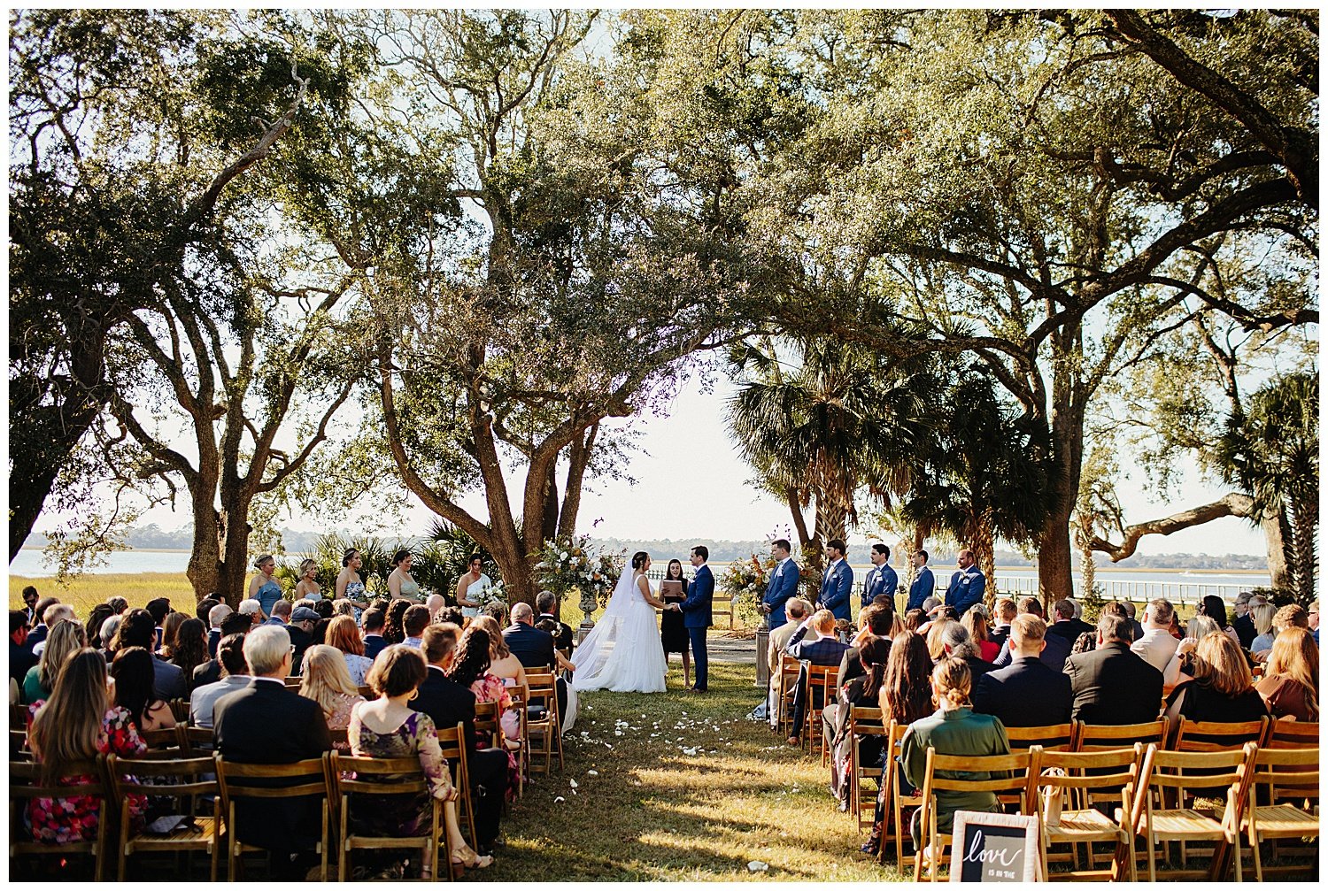 lowndes grove wedding ceremony under trees oaks