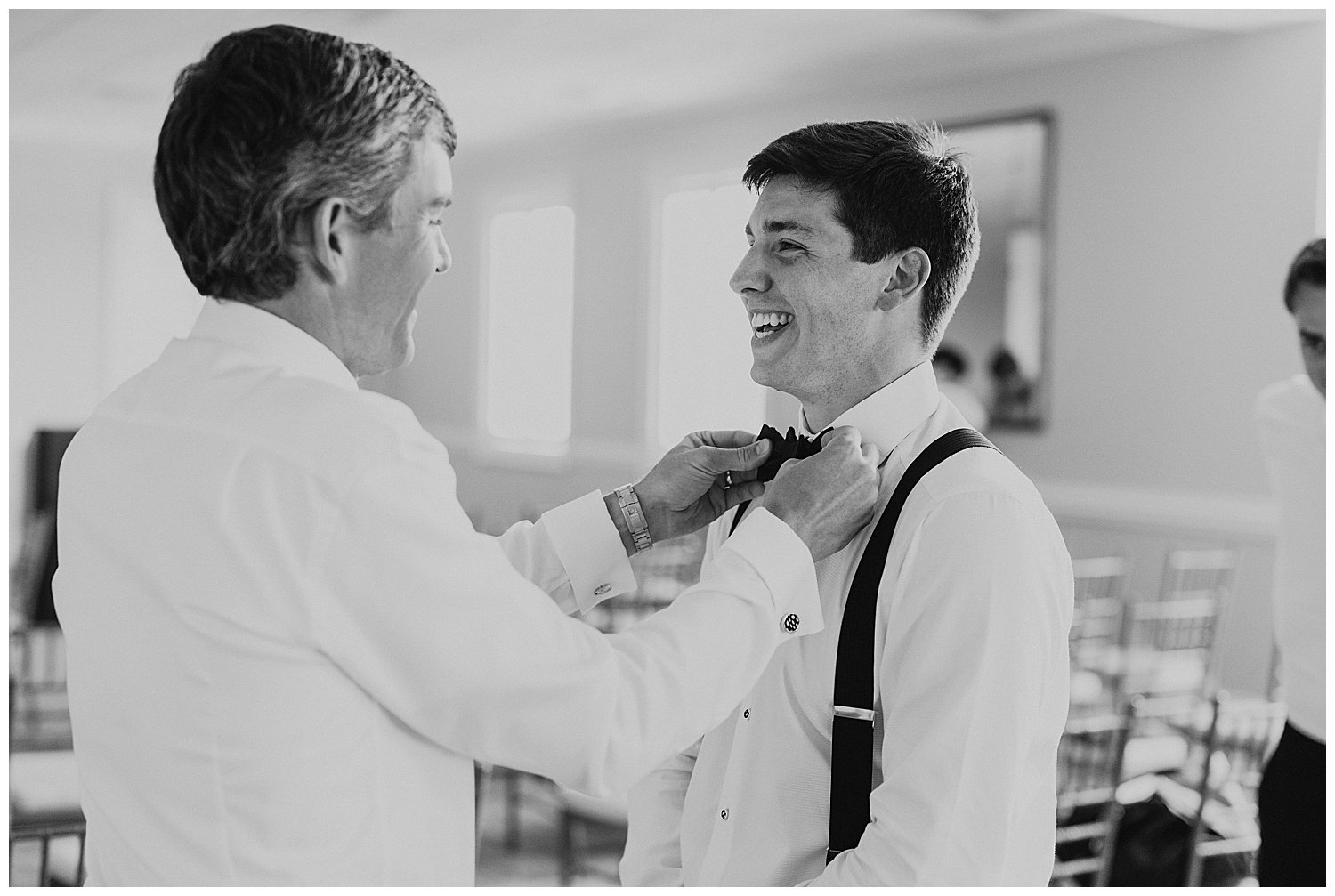 groom getting ready with brother