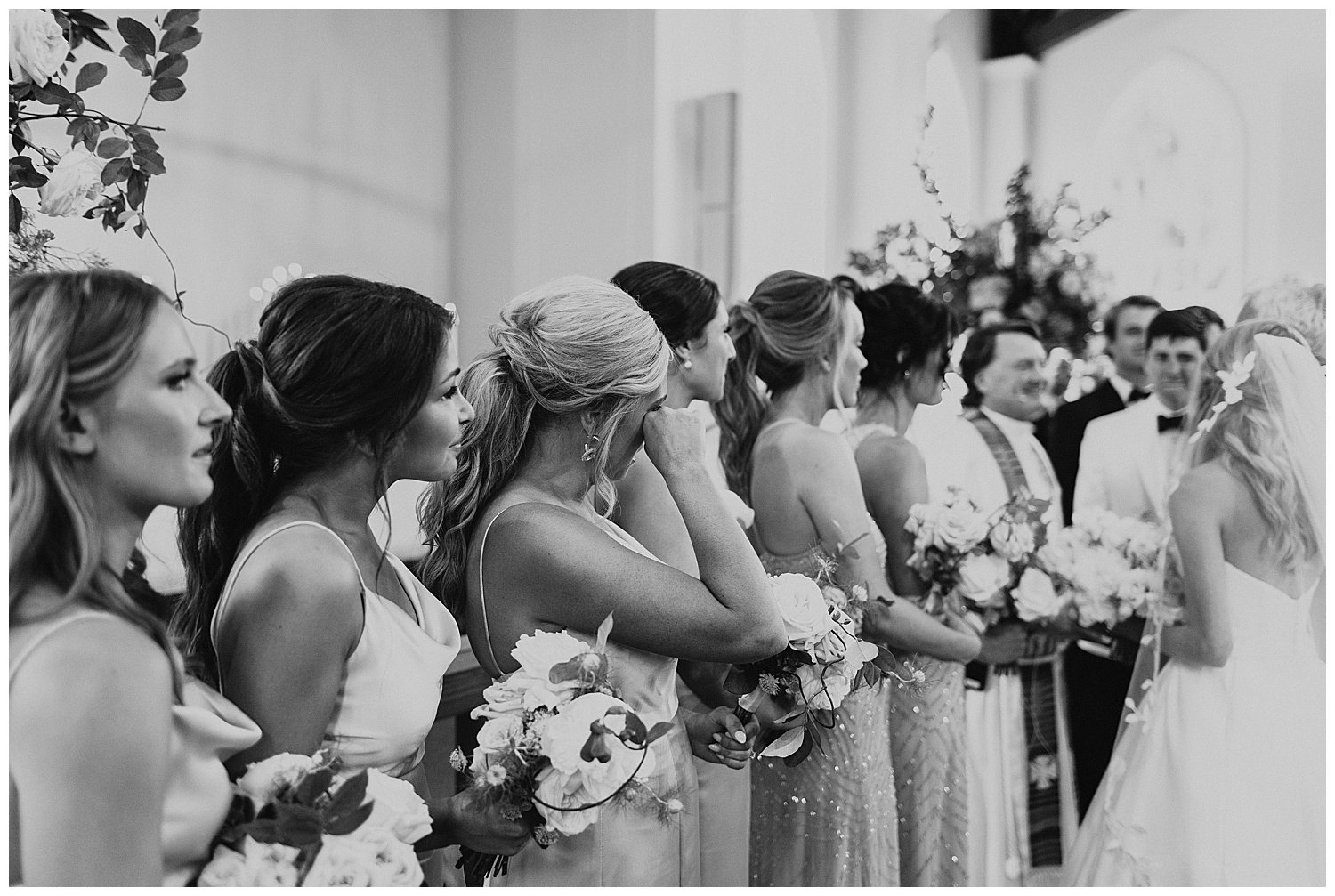 emotional bridesmaids during wedding ceremony