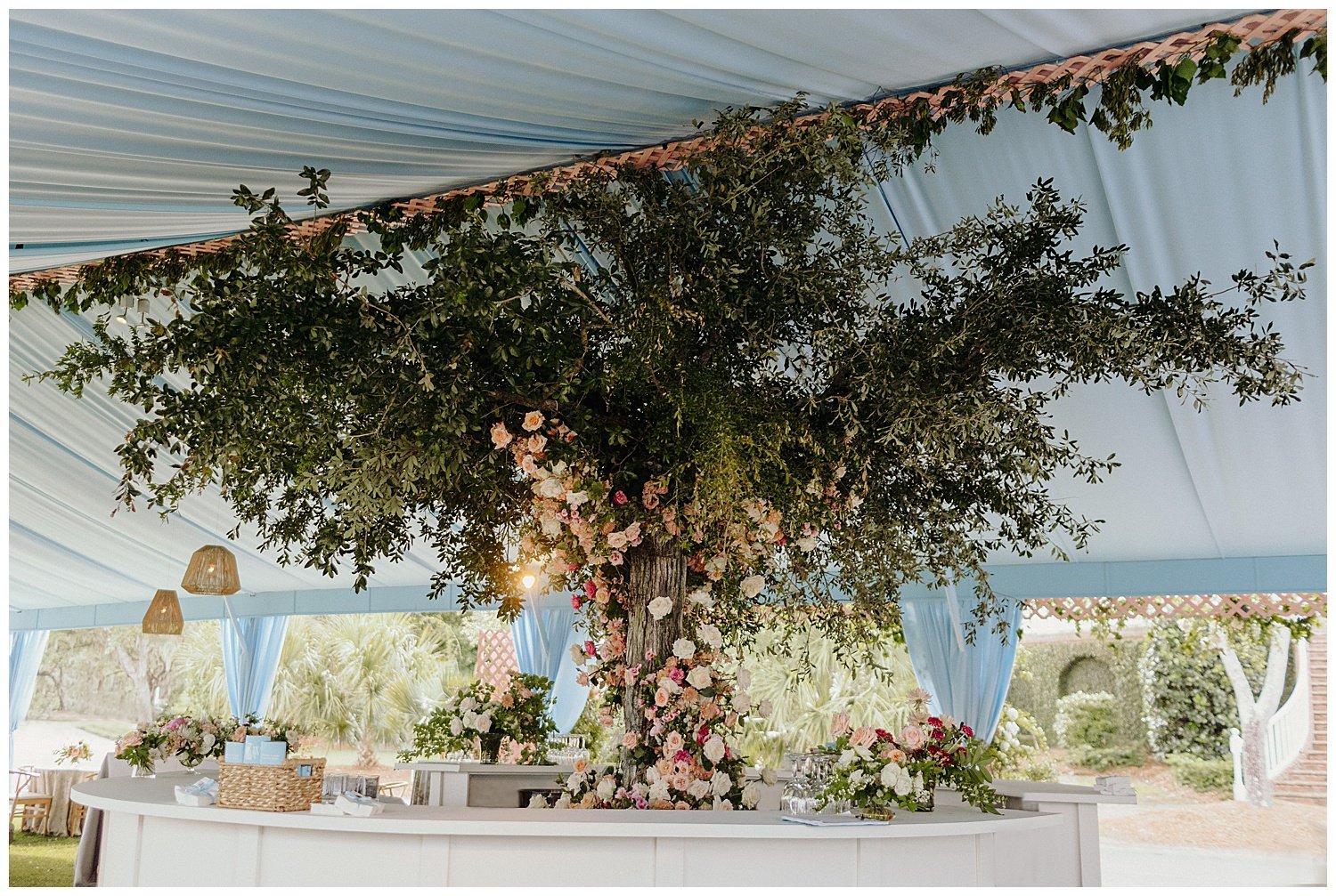 floral installation inside wedding reception tent
