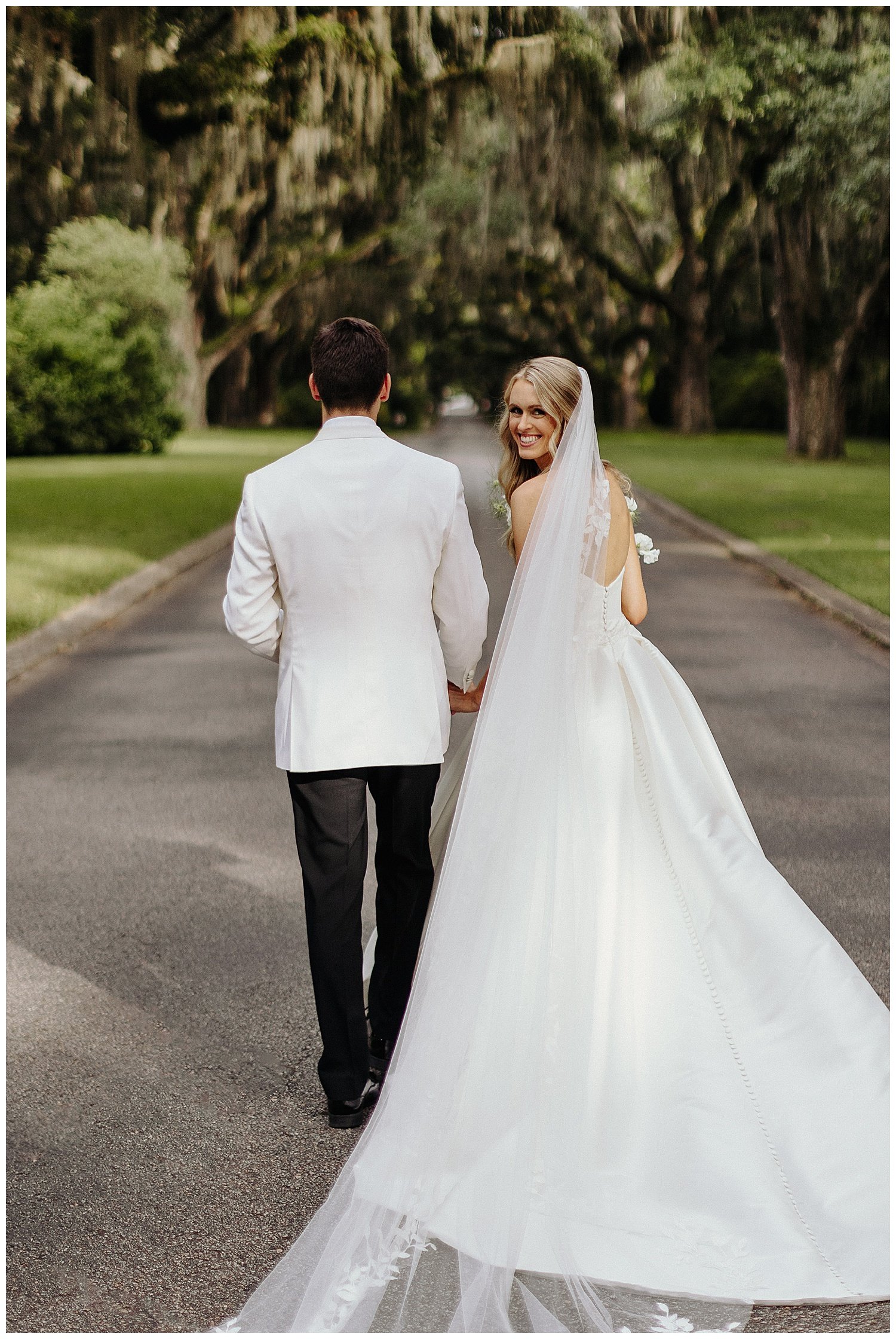 bride with long veil on wedding day