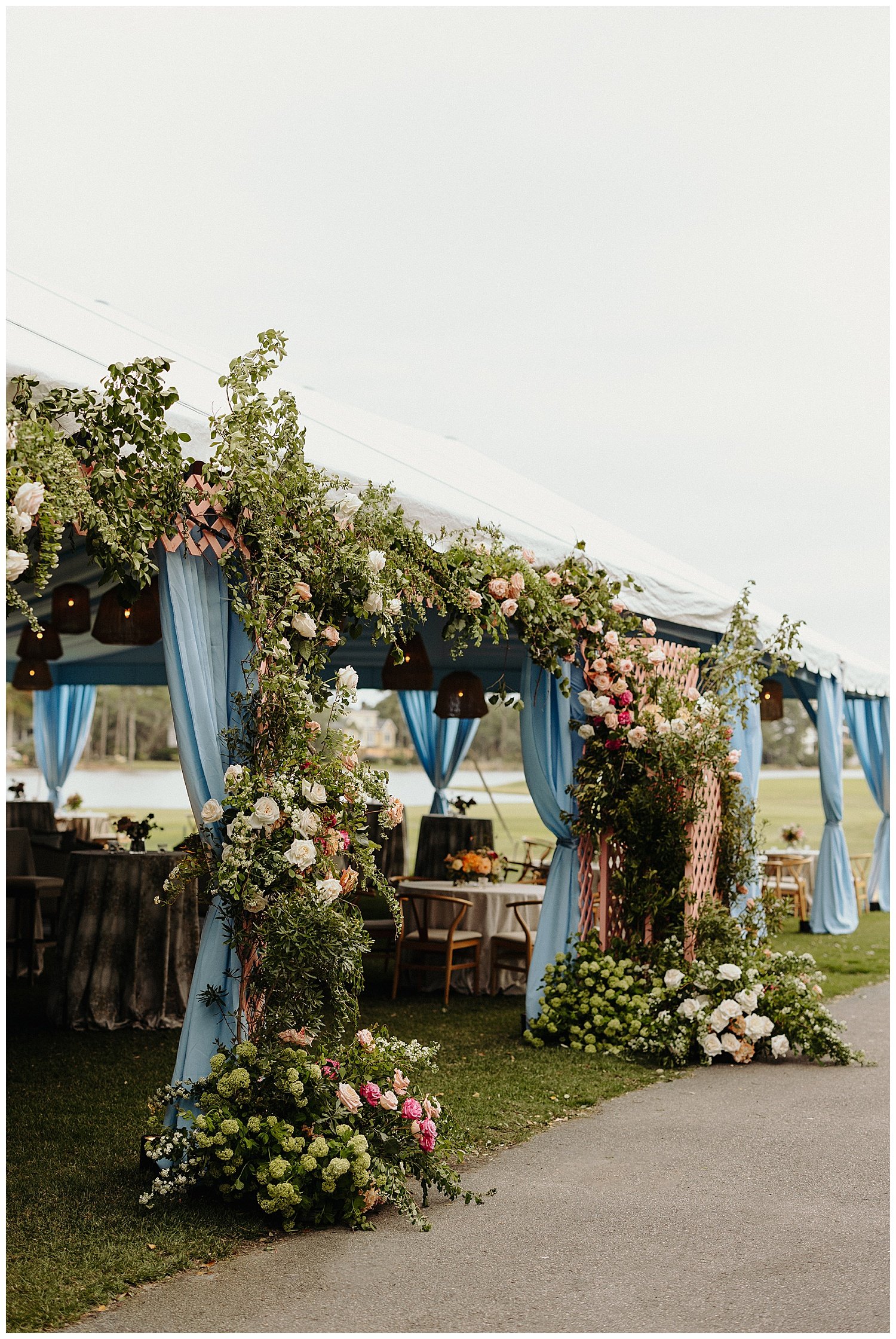 floral entrance to tent wedding reception
