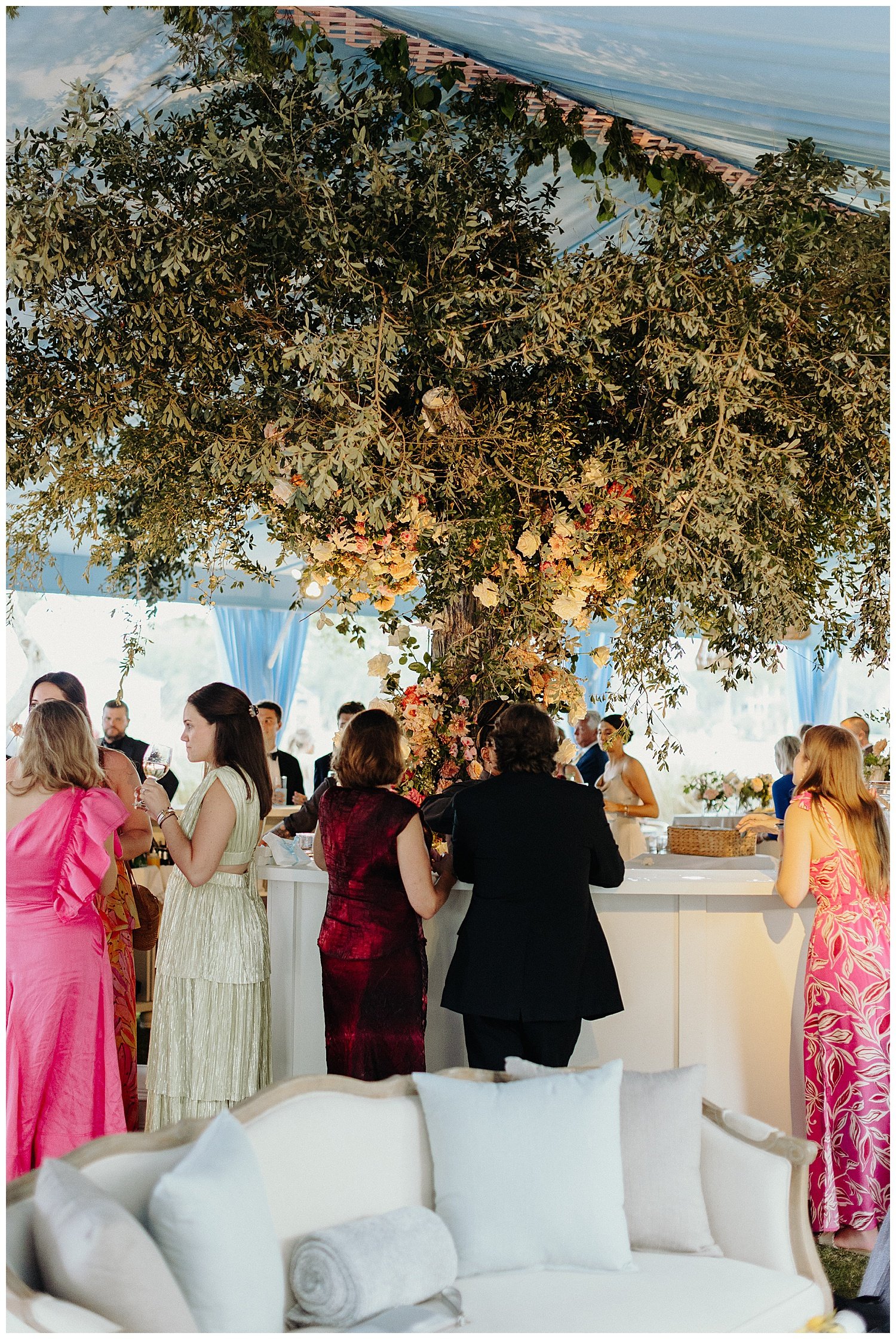 guests enjoying wedding reception floral installation