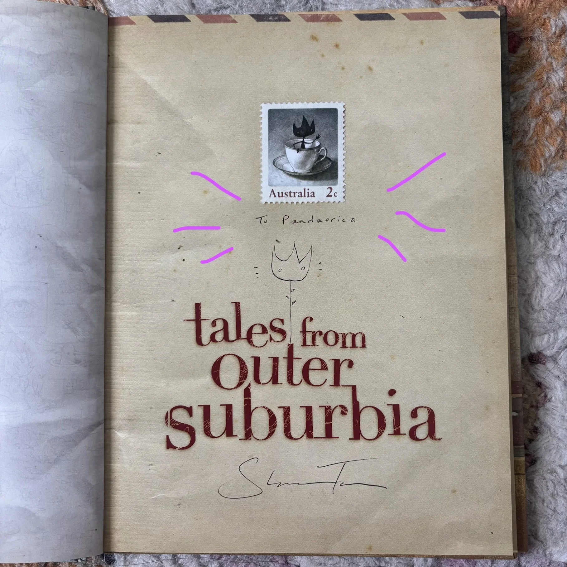  Autographed copy of Tales From Outer Suburbia by Shaun Tan after his keynote speech at the SCBWI winter conference circa 2013 