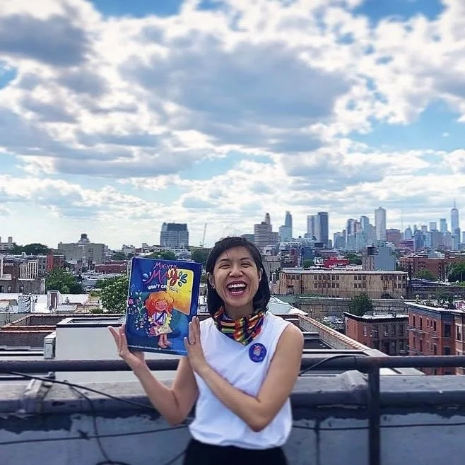  PandaErica celebrating the release of her picture book debut, Mighty May Won’t Cry Today, while social distancing atop her former Brooklyn apartment circa 2020  
