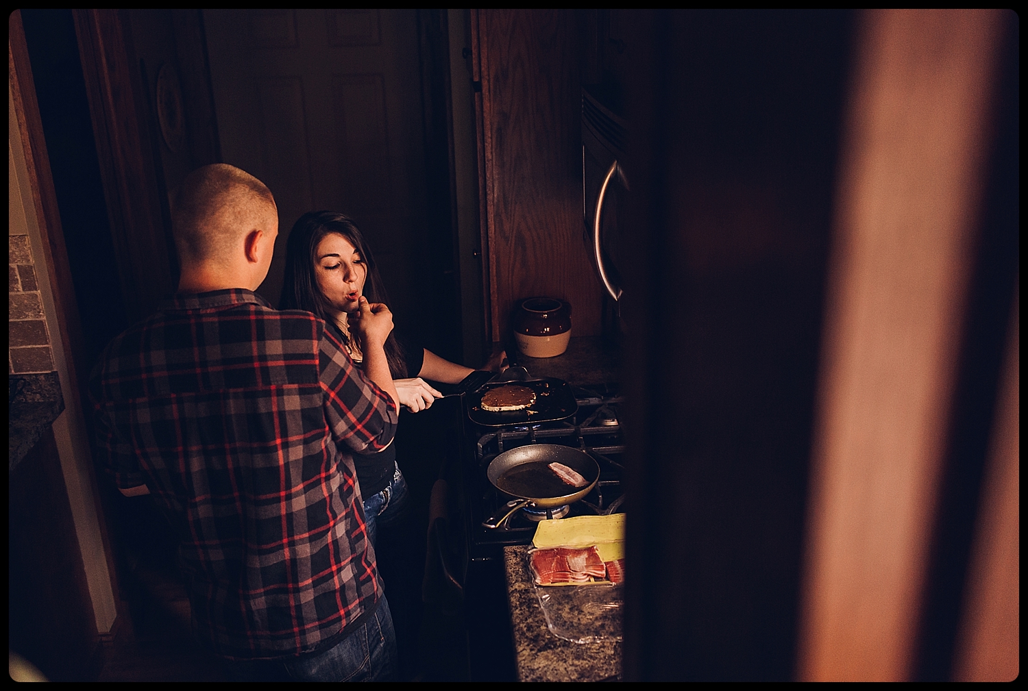 Man feeds fiance breakfast.