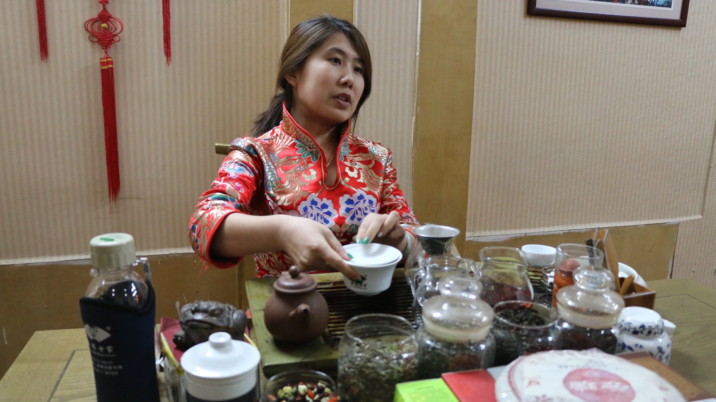 Tea garden merchant giving us tastes of the different tea selections.