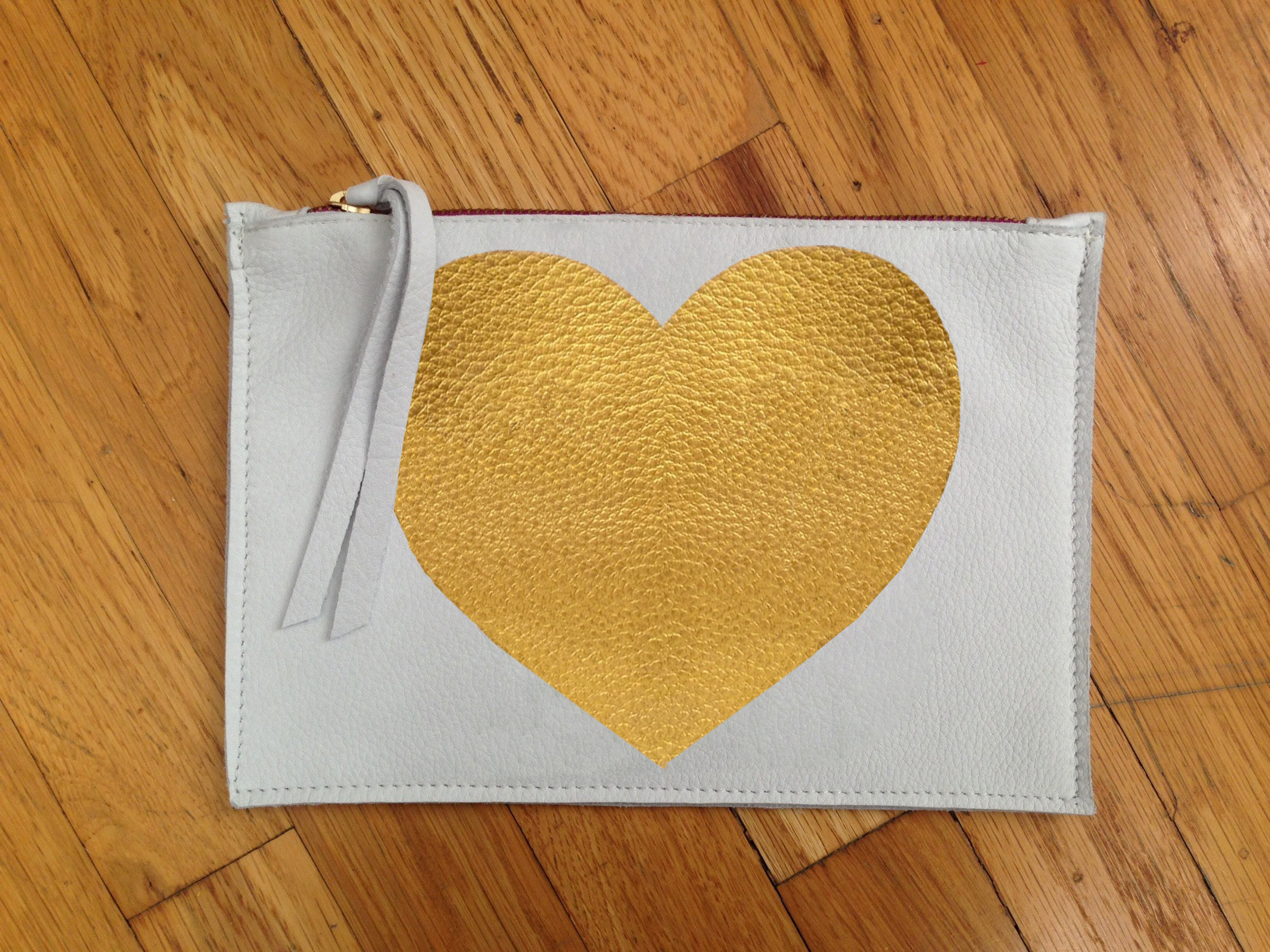 Leather zippered pouch with painted Heart in gold.