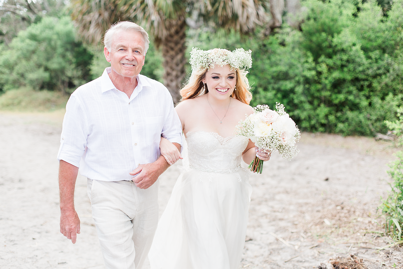 Bride and her dad walking down the isle on a beach wedding in Jekyll Island.