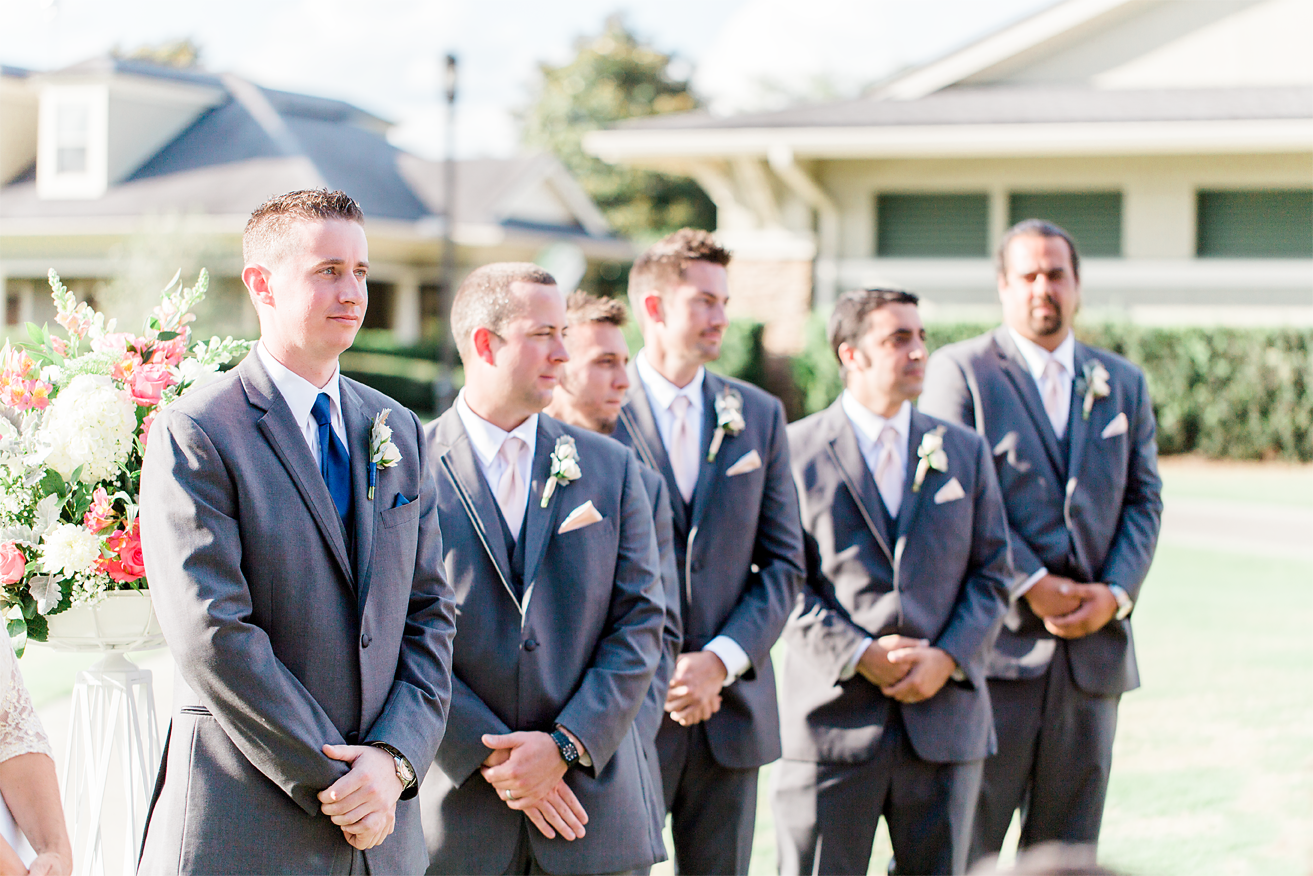 groom and groomsmen waiting for the bride to walk down the isle