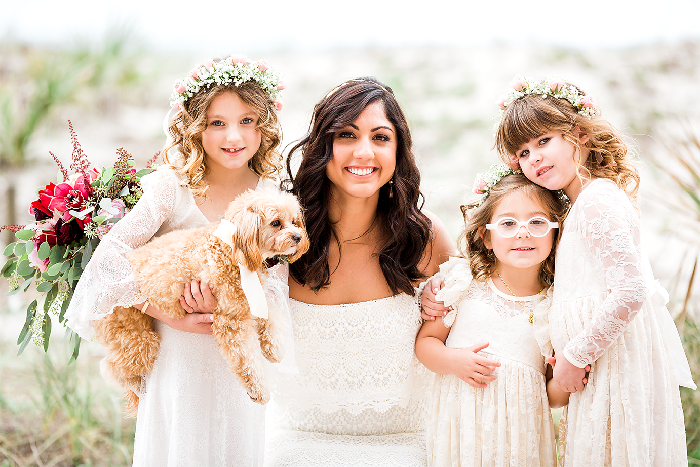 bride with flower girls and her dog who was part of the wedding