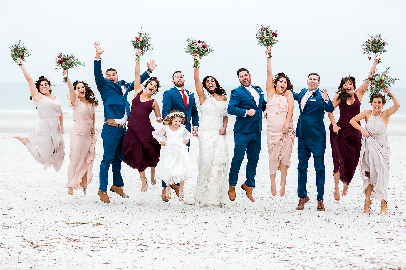 bridal party jumping picture at the beach