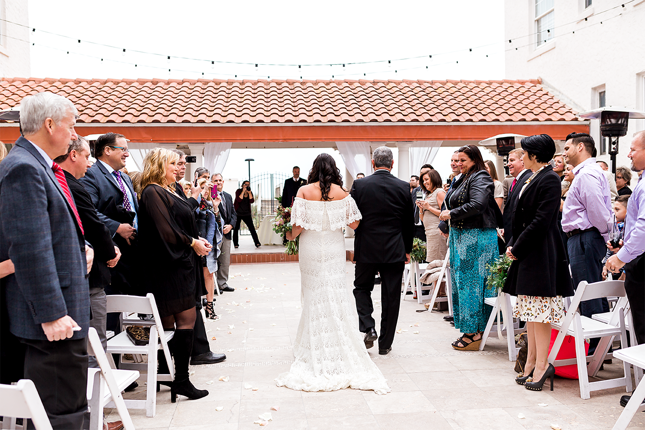 bride walking down the isle with her dad in jacksonville beach wedding
