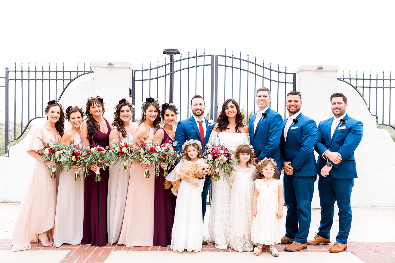 bride and groom with entire bridal party in jacksonville beach wedding