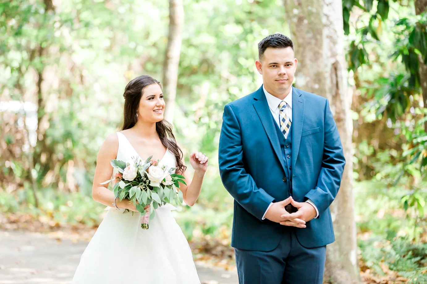 bride and groom doing first look at the wedding