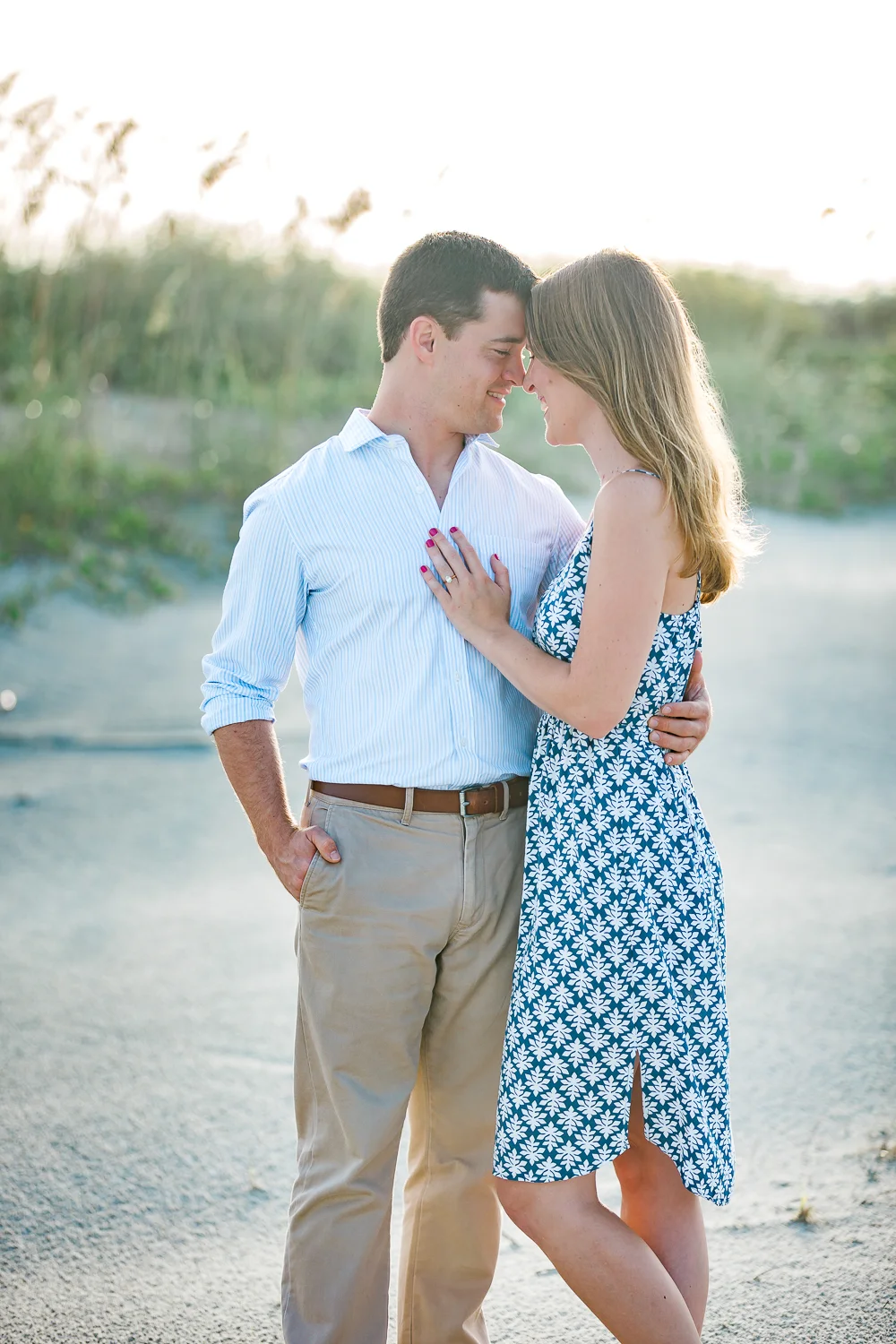 engaged couple at the beach