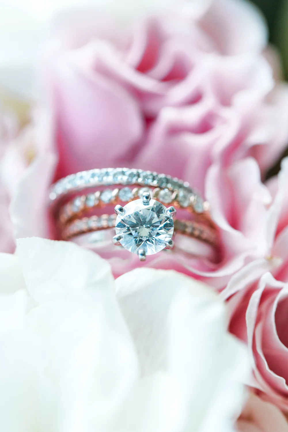 Bride’s engagement ring and wedding bang close up shot