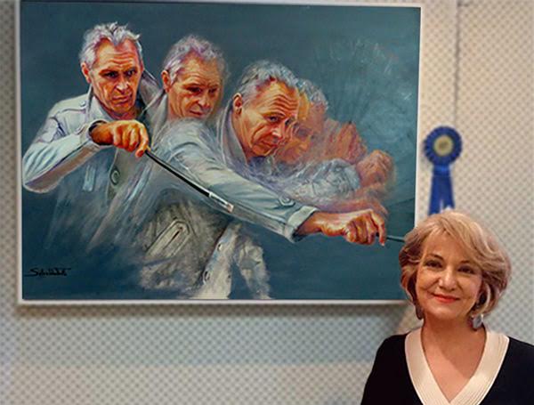 Salwa with her award winning portrait of Paul Ryan