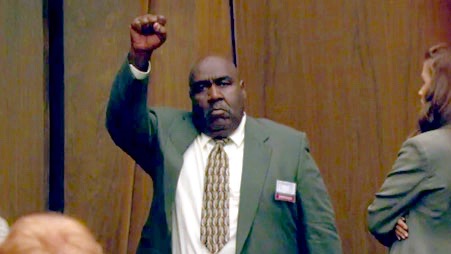 Juror Lionel (Lon) Cryer giving O.J. the black power fist. As The New York Times reported, Cryer was a former Black Panther whom prosecutors had inexplicably left on the panel. 