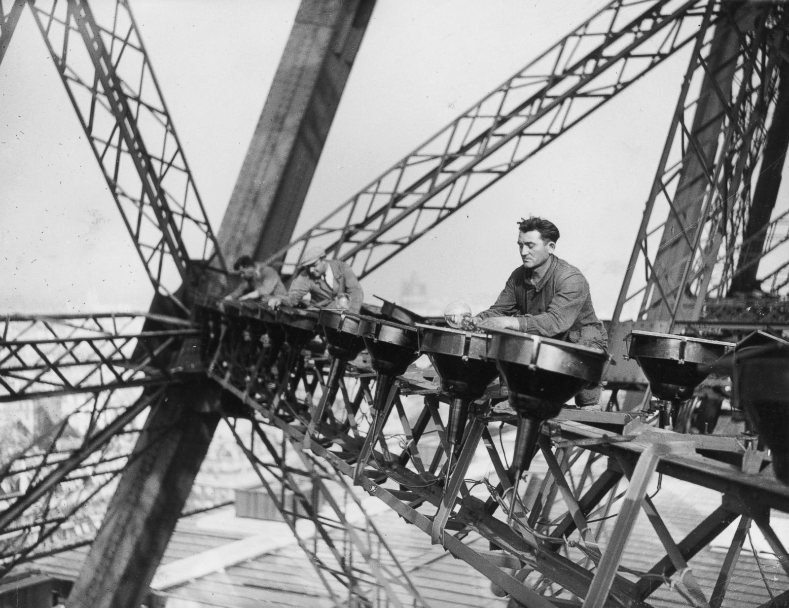 Workers installing lights on the tower.