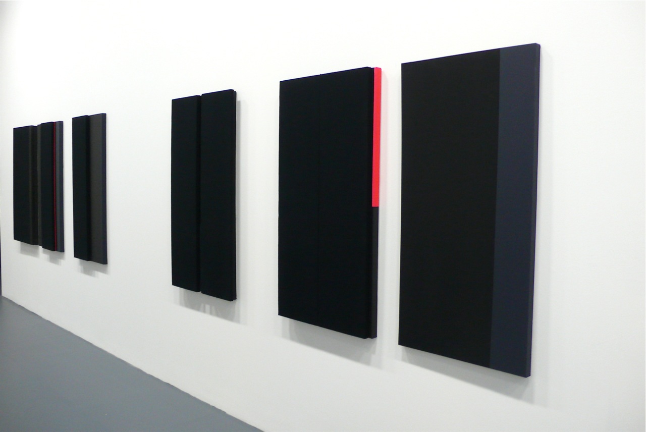 Installation shot of Jennie C. Jones's paintings using acoustic absorber panels.
