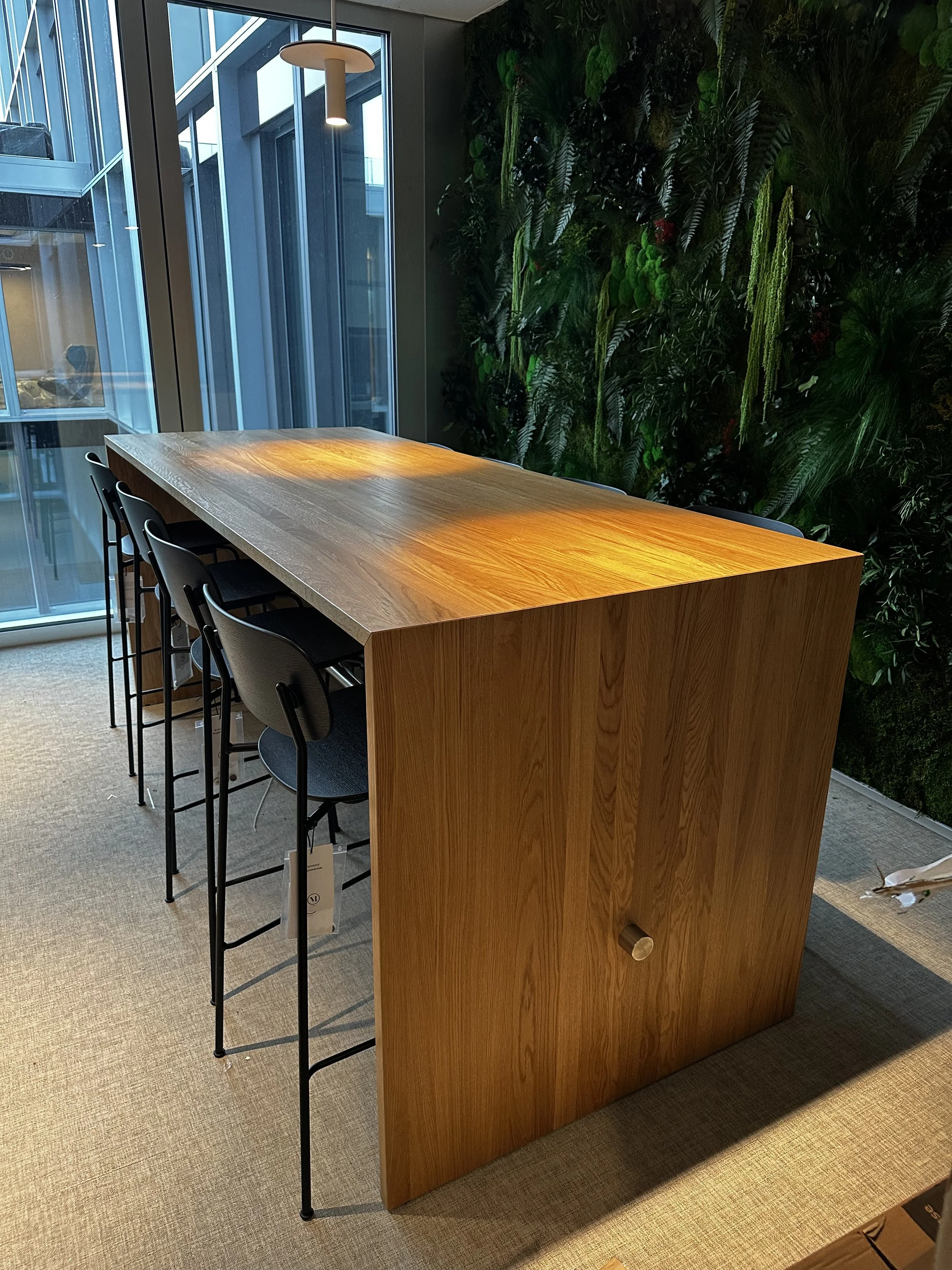 High table by Blastation and barstools by Audo