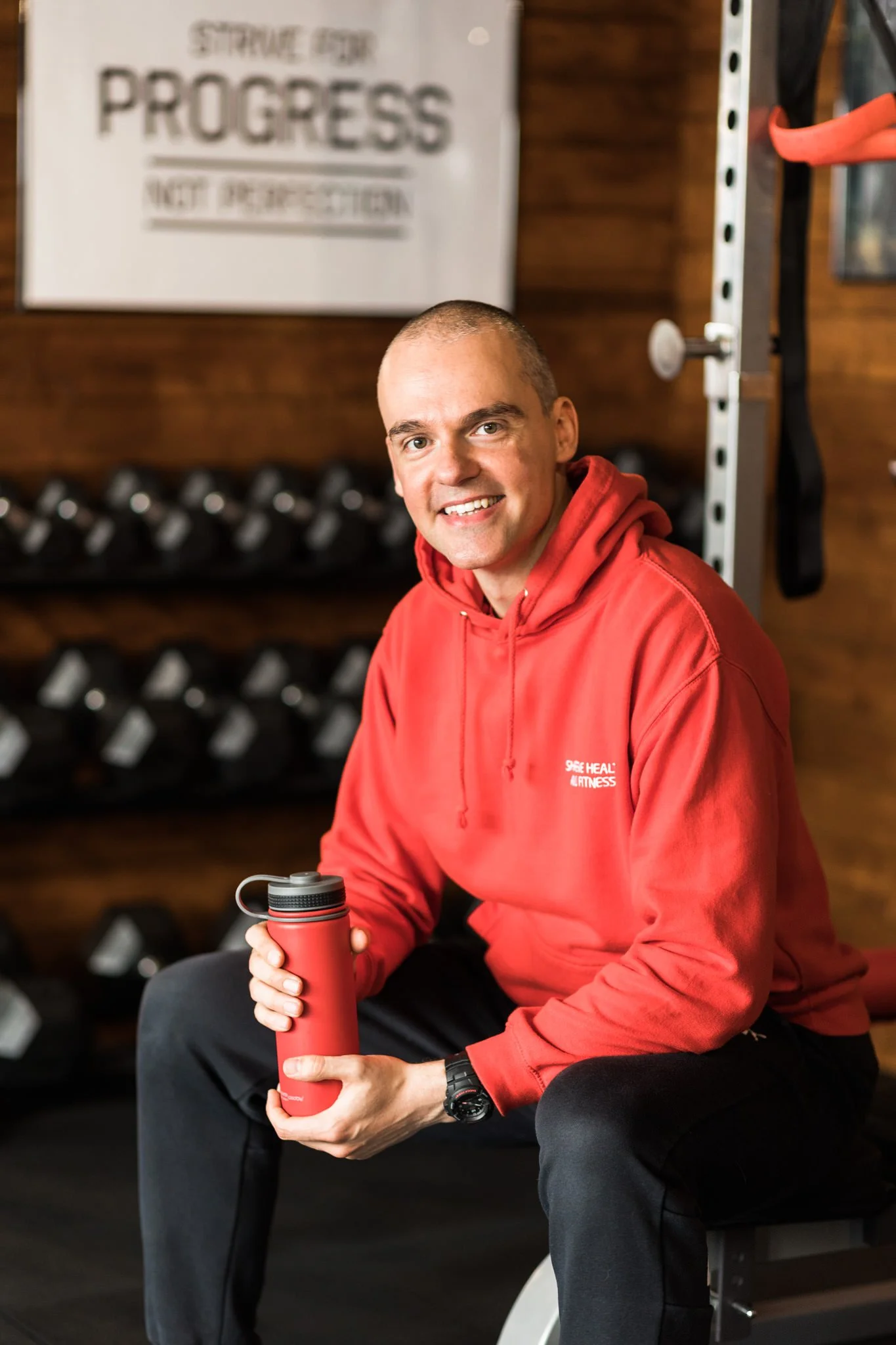 Fitness trainer holding a water bottle