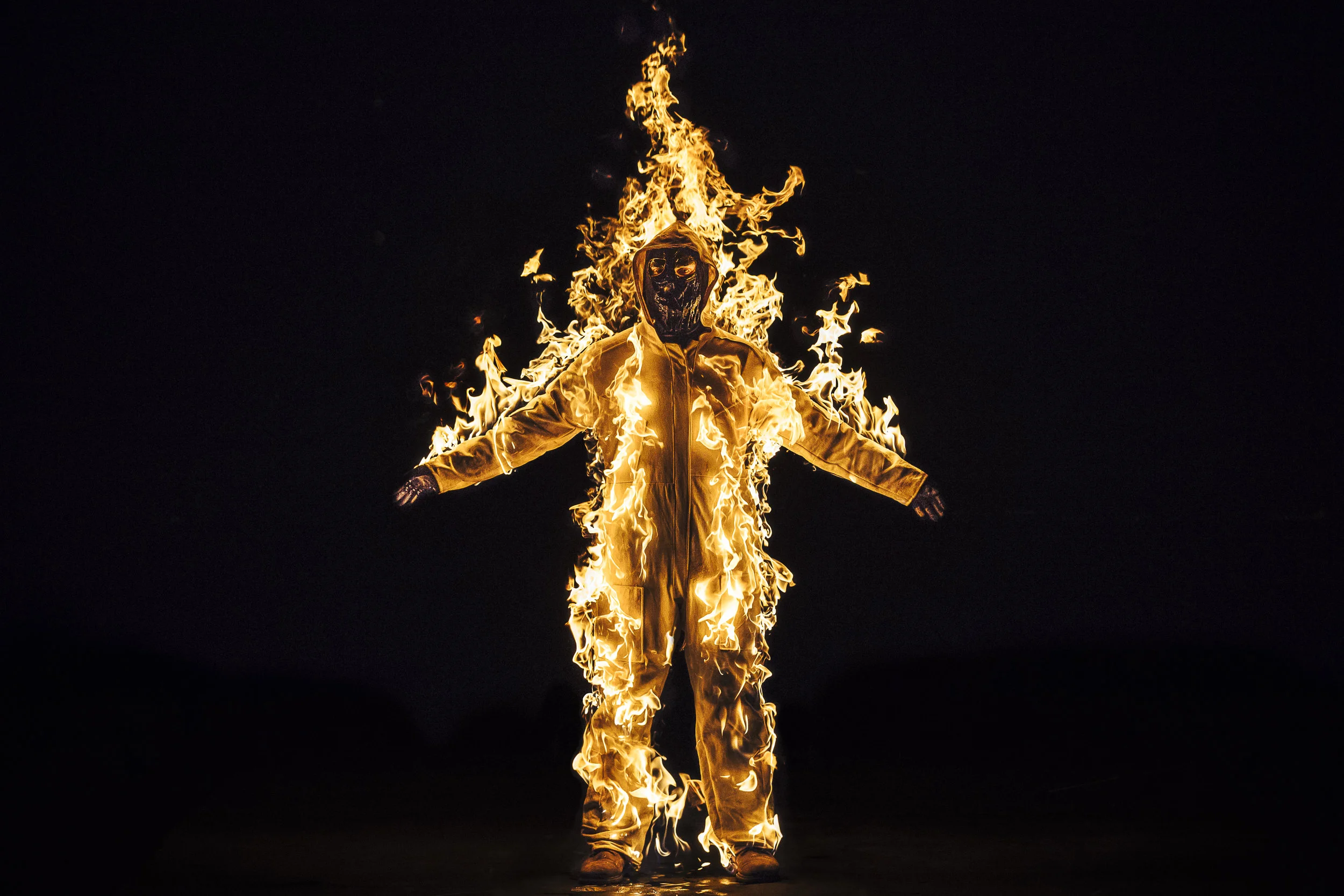 Cassils is lit on fire during their performance Inextinguishable Fire , performed on Nov 8, 2015 at the National Theatre in London as part of SPILL Festival of Performance. Photo credit: Cassils with Guido Mencari © Cassils 2015 Image courtesy of the artist and Ronald Feldman Fine Arts
