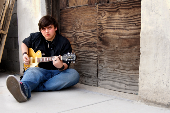 Shop assistant Josiah and his trusty goldtop. 