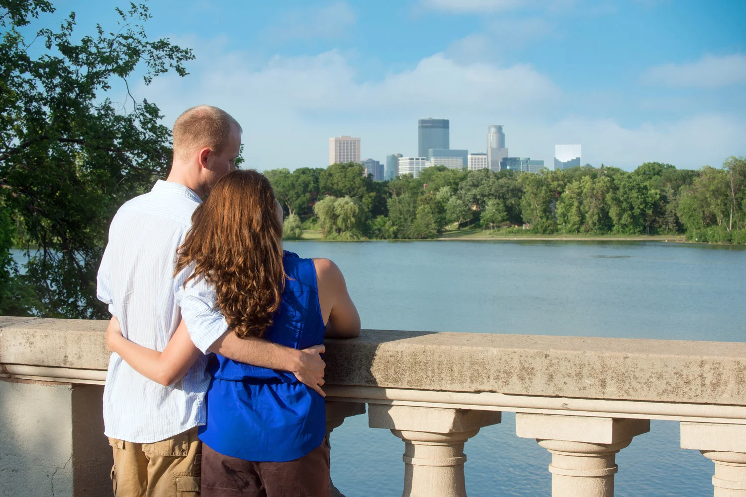 A Twin Cities couple takes in the view of the Minneapolis skyline from the Kenwood Neighborhood.