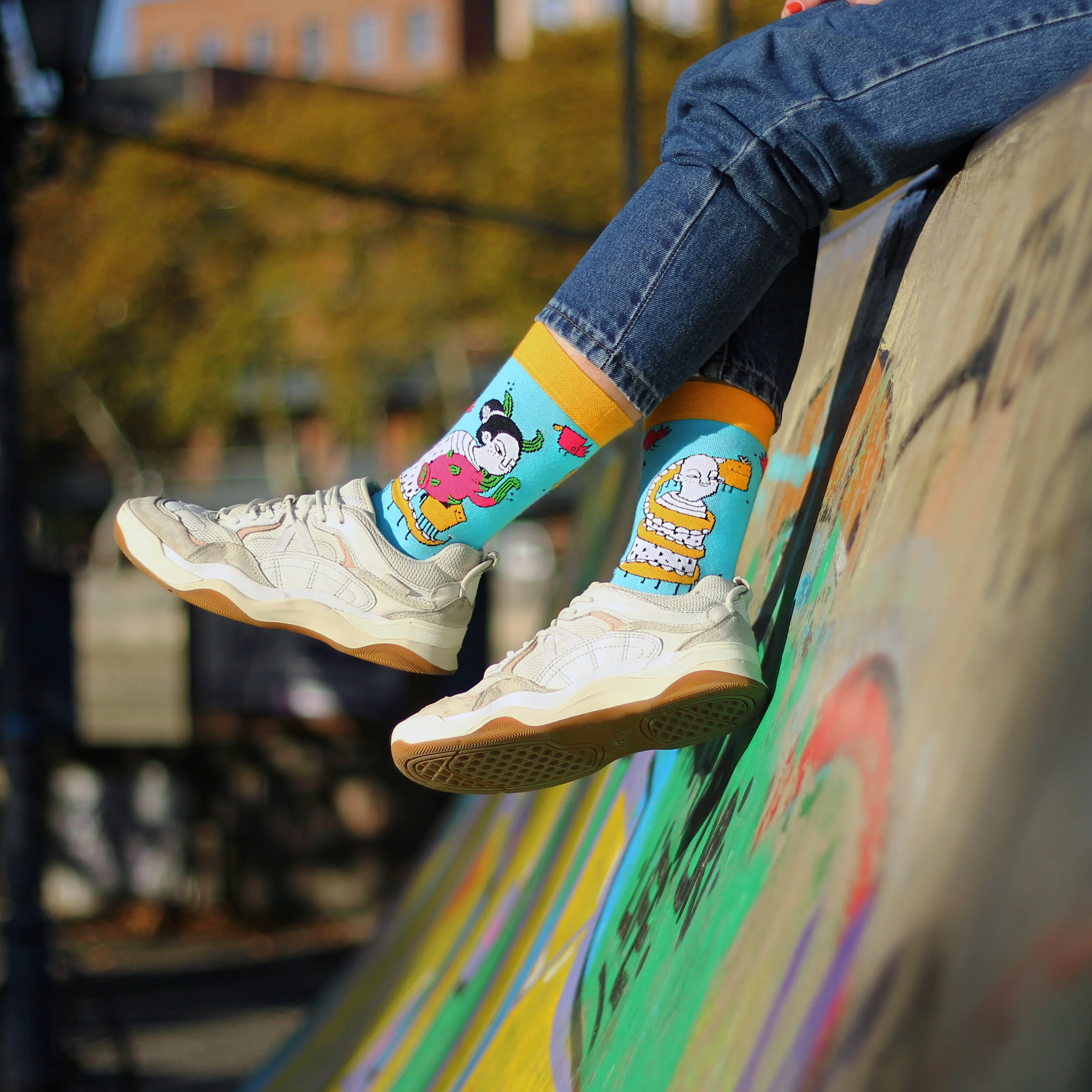 Side view of Masholand x AlterSocks collaboration socks being worn with sneakers.